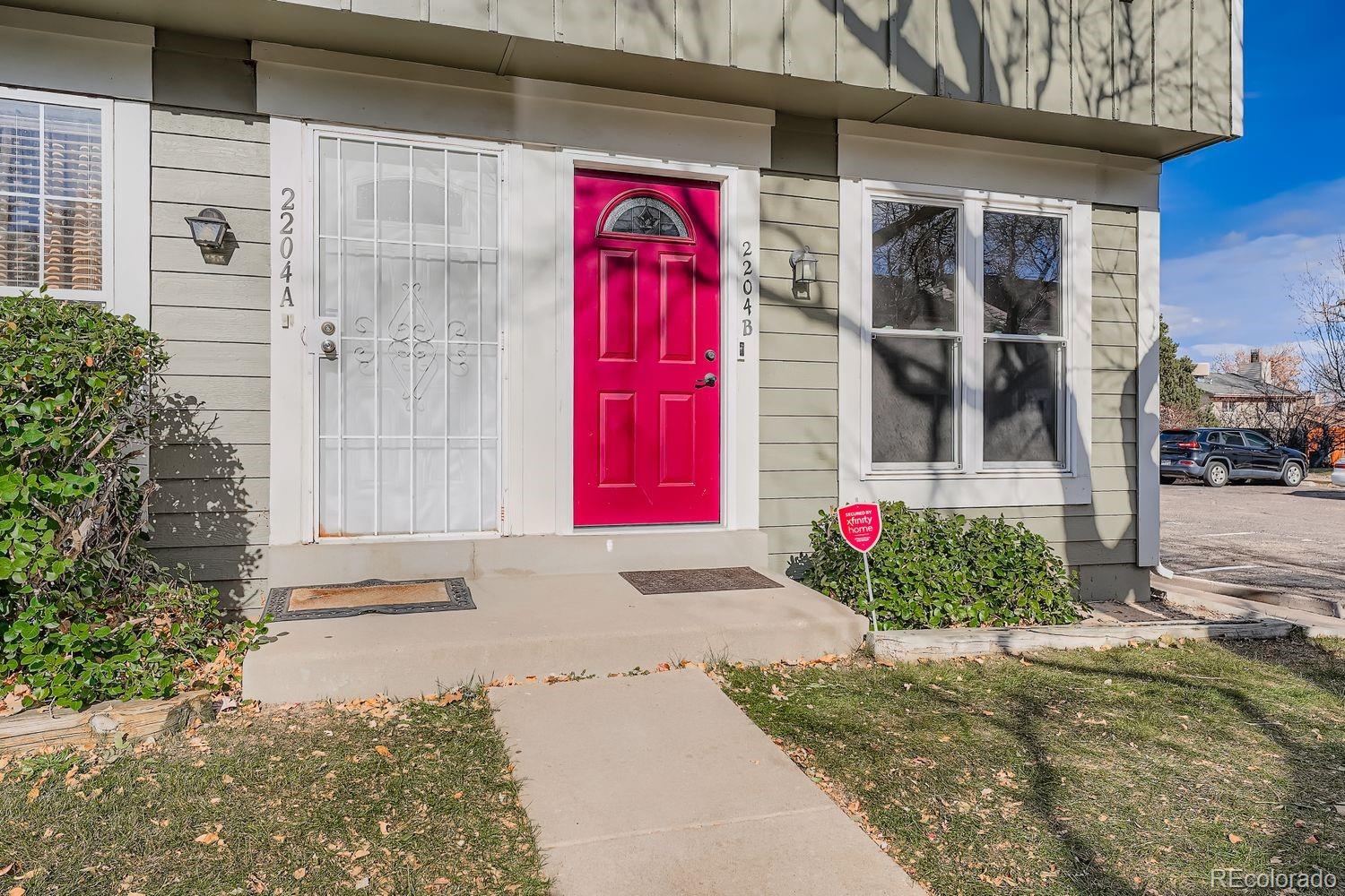 2204 South Jasper Way, Unit B Aurora, CO 80013 - Photo 2 of 19 a house with red door