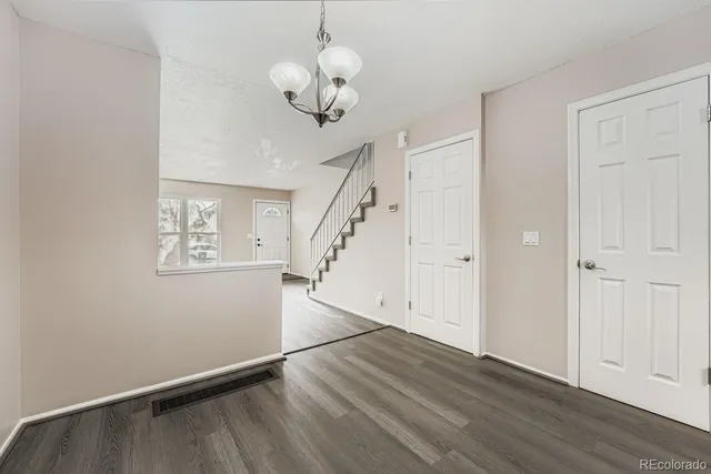 a view of entryway with wooden floor