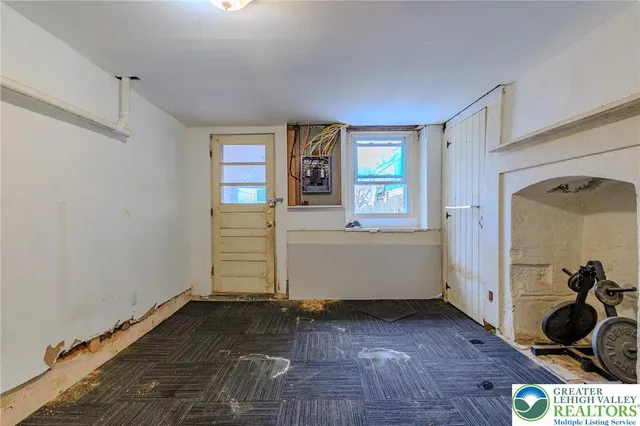 a view of room with window and hardwood floor