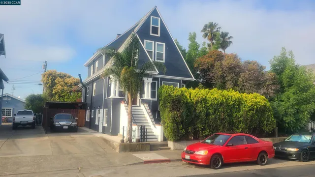 a front view of a house with parking