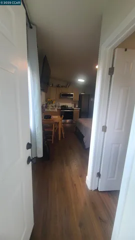 a kitchen with stainless steel appliances a stove refrigerator sink and microwave