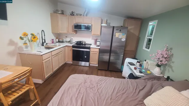 a bedroom with bed and a window