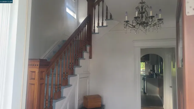 a kitchen with a refrigerator and a sink