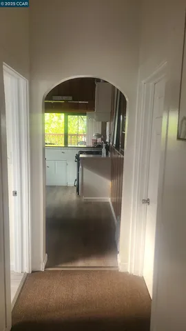 a kitchen with a refrigerator and a sink