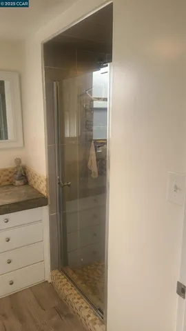 a bed room with a bed and a chandelier