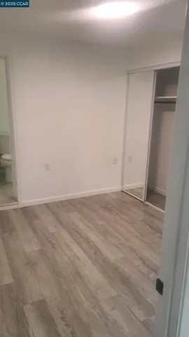 a white toilet sitting next to a white sink