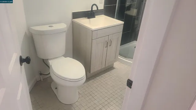 a kitchen with stainless steel appliances a refrigerator and a stove