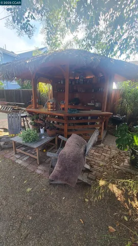 a view of a backyard with sitting area