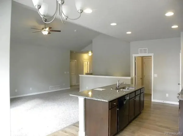 a kitchen with kitchen island cabinets and window