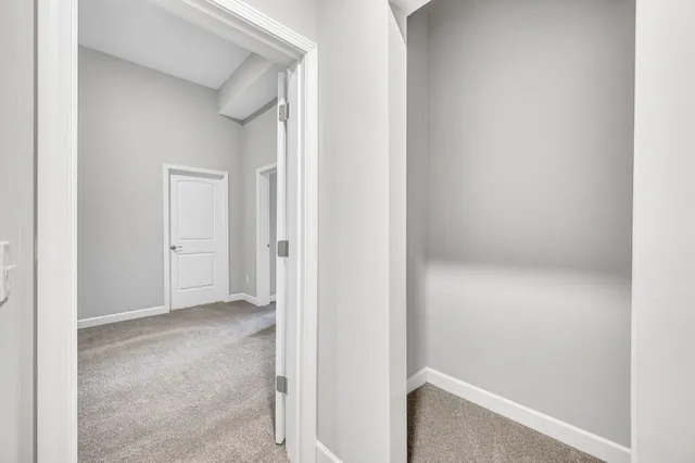 an empty room with closet area