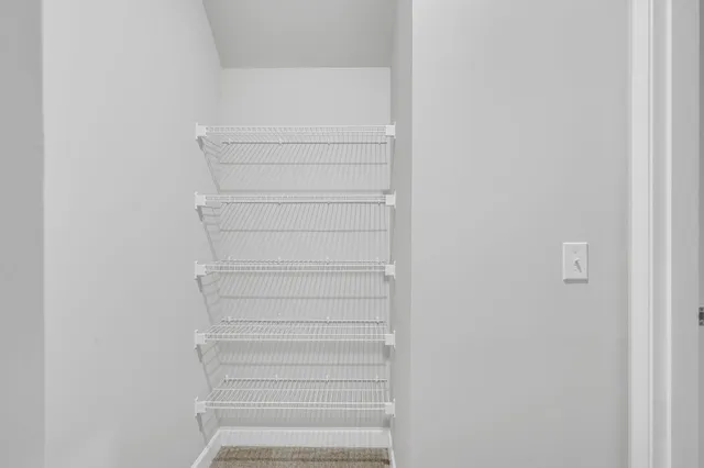 a view of a room with racks on the wall