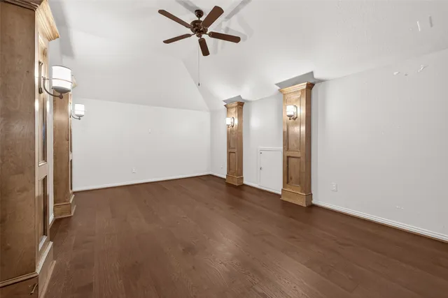 a view of a big room with wooden floor closet and windows