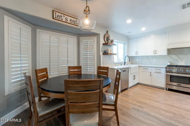 a view of a dining room with furniture window and wooden floor