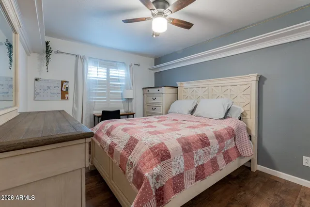 a spacious bathroom with a double vanity sink a mirror and a bathtub