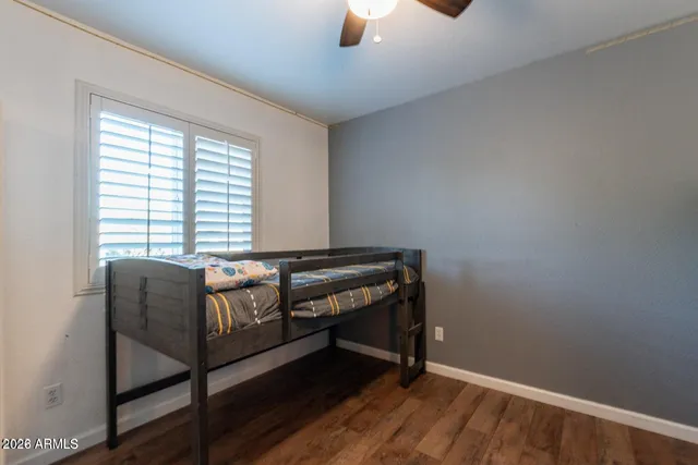 a living room with flat screen tv on wall and a flat screen tv