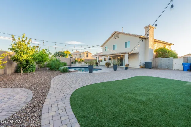 a bathroom with a toilet a sink and a mirror