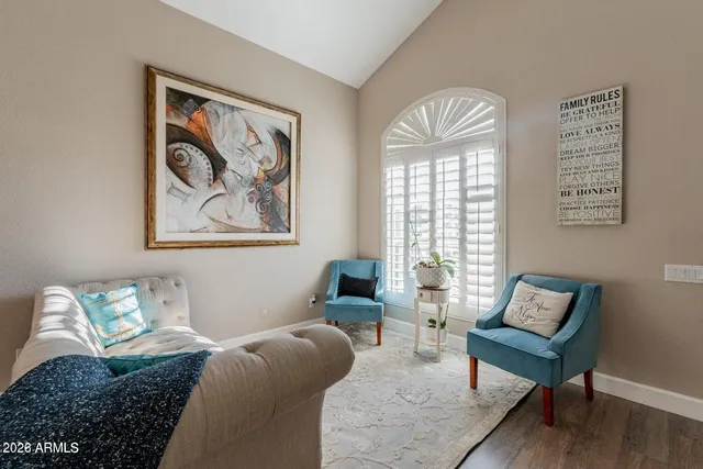 a bed room with furniture and a window