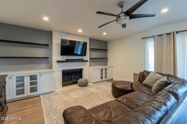 a living room with furniture and a large window