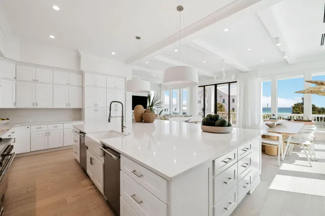 a spacious bedroom with a large bed and a large window