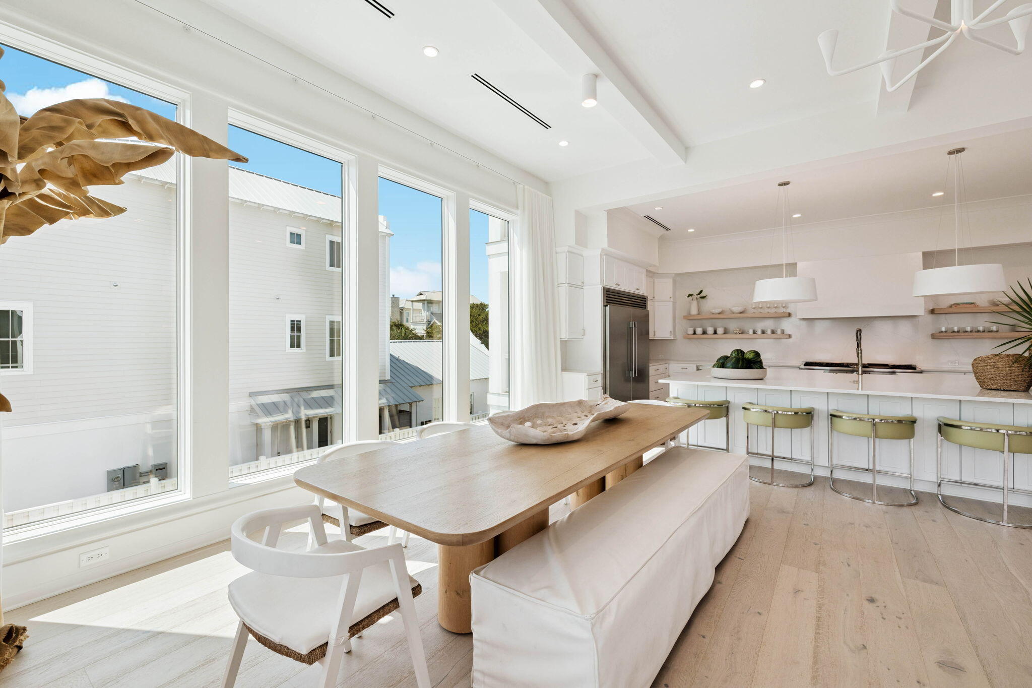 329 Winston Ln Inlet Beach Inlet Beach, FL 32461 - Photo 41 of 95 a kitchen with stainless steel appliances granite countertop table chairs sink and cabinets