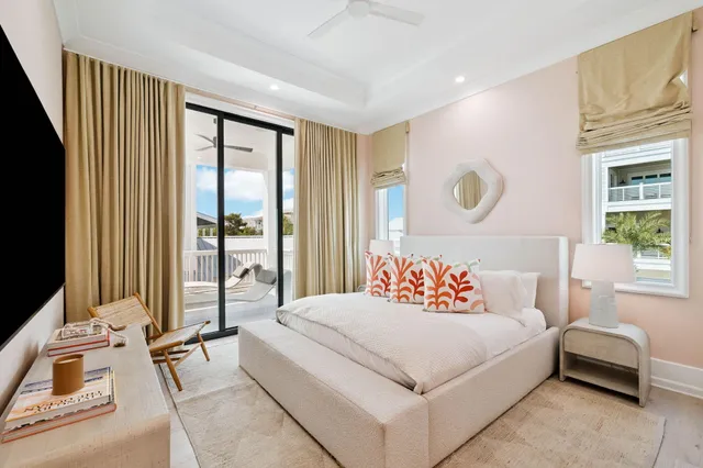 a view of a roof deck with couches and wooden floor