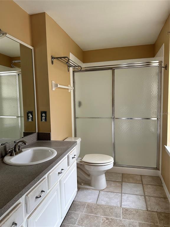 420 Summit Ridge Place, Unit 316 Longwood, FL 32779 - Photo 11 of 19 a bathroom with a sink toilet a mirror and shower