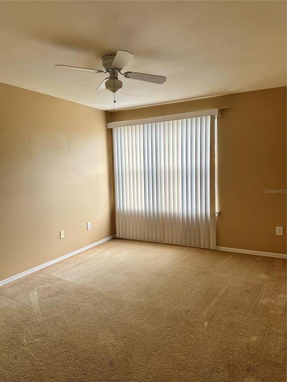 420 Summit Ridge Place, Unit 316 Longwood, FL 32779 - Photo 14 of 19 a view of an empty room with a window