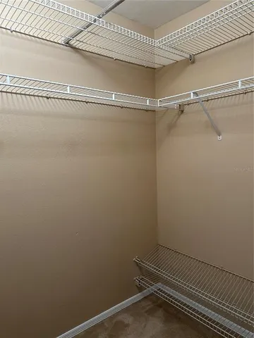 a view of a room with racks on the wall