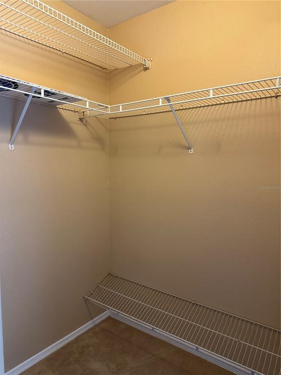 420 Summit Ridge Place, Unit 316 Longwood, FL 32779 - Photo 17 of 19 a view of a room with racks on the wall