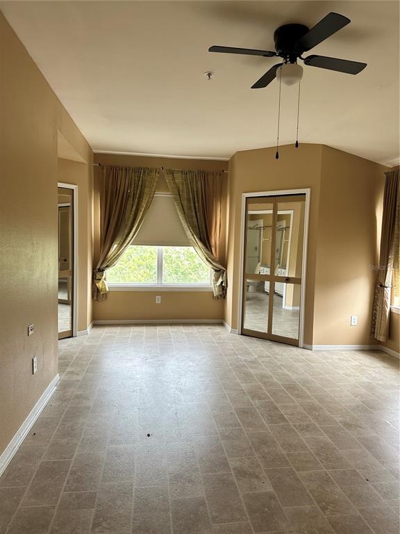 420 Summit Ridge Place, Unit 316 Longwood, FL 32779 - Photo 9 of 19 a view of empty room with a fireplace and windows