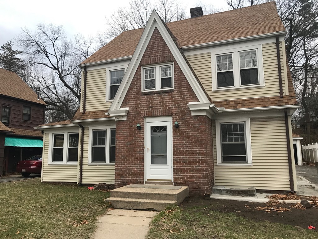 606 Alden Street Springfield, MA 01109 - Photo 1 of 22 a front view of a house with a yard