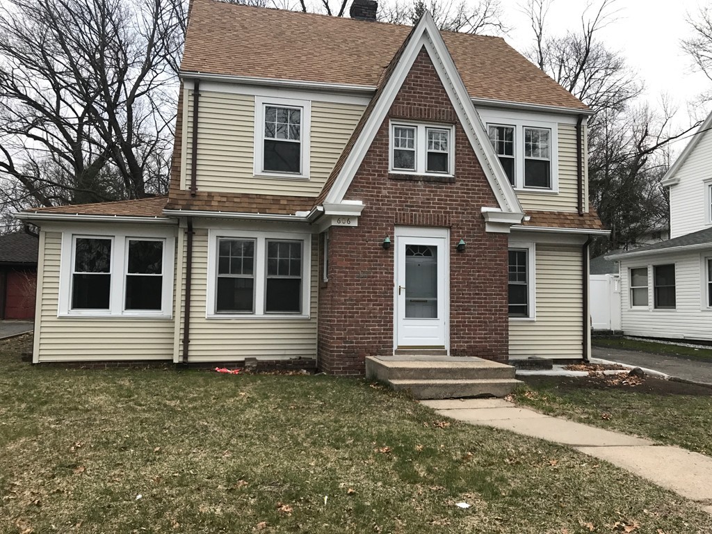 606 Alden Street Springfield, MA 01109 - Photo 2 of 22 a front view of a house with a yard
