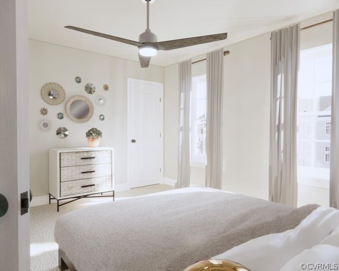 6932 Leire Lane Chesterfield, VA 23832 - Photo 12 of 14 a bedroom with a bed and a chandelier