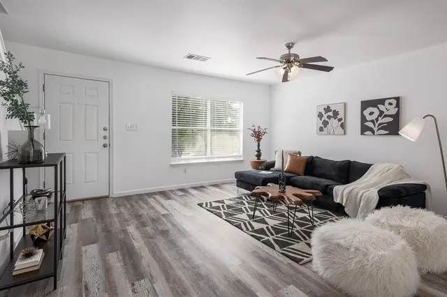 a living room with furniture and a window