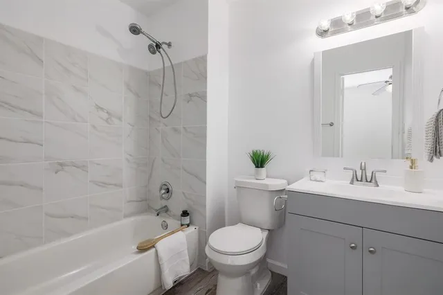 a bathroom with a sink toilet and bathtub