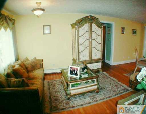 34 South Hill Road Colonia, NJ 07067 - Photo 2 of 8 a living room with furniture and a window