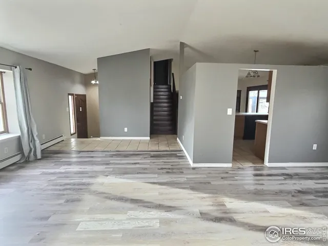 a kitchen with stainless steel appliances granite countertop a refrigerator a stove a sink and a refrigerator