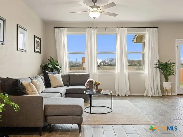 a living room with furniture and a window