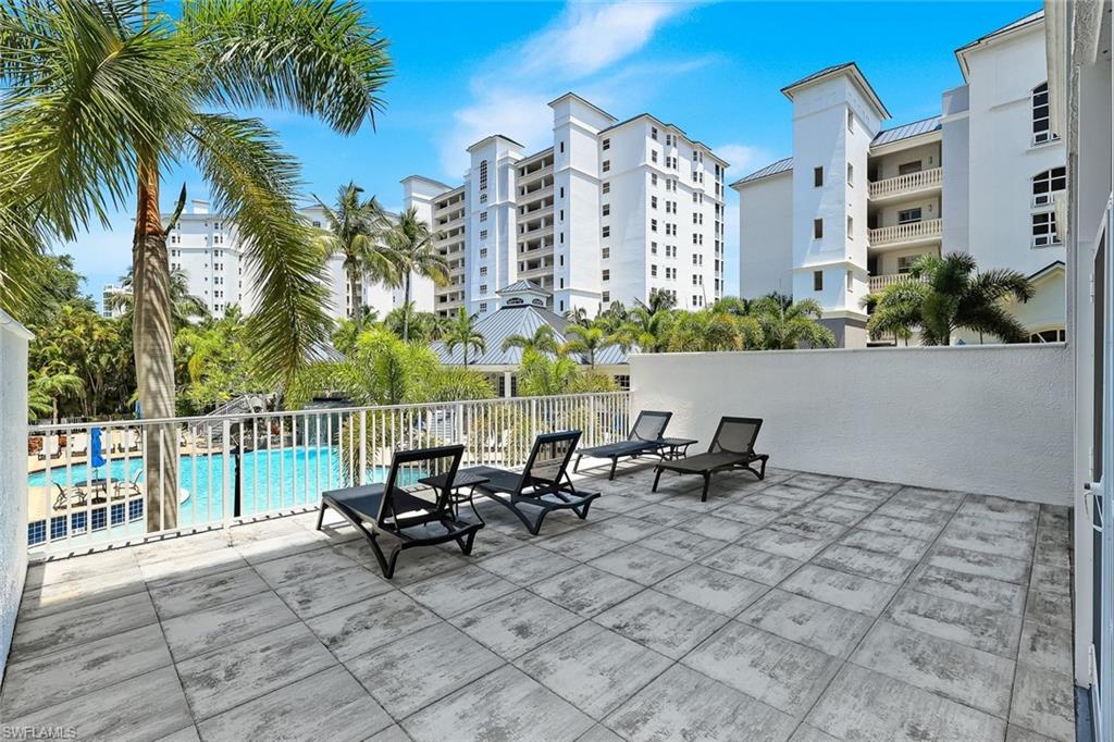 460 Launch Circle, Unit 202 Naples, FL 34108 - Photo 18 of 34 a view of a terrace with sitting area