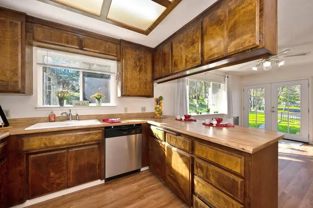 a kitchen with a sink stove and cabinets