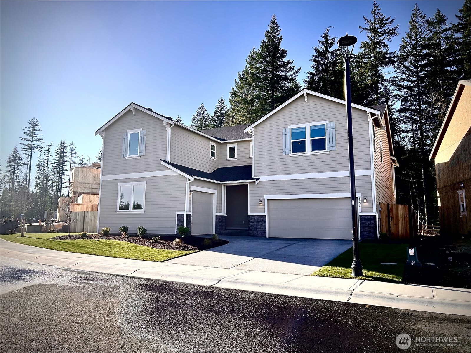 a front view of a house with yard