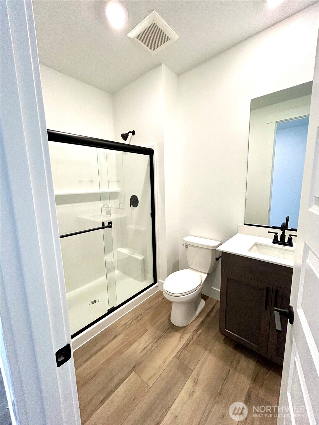 6034 Trce Drive Southwest Port Orchard, WA 98367 - Photo 13 of 40 a bathroom with a sink and a mirror