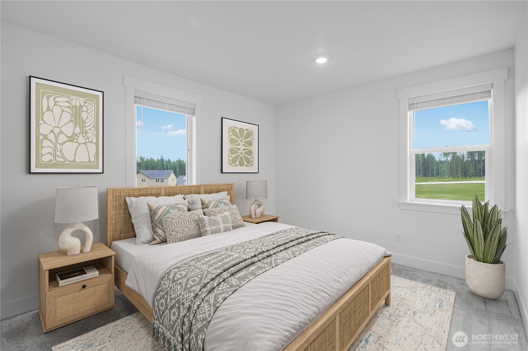 6034 Trce Drive Southwest Port Orchard, WA 98367 - Photo 17 of 40 a bedroom with a large bed and a potted plant