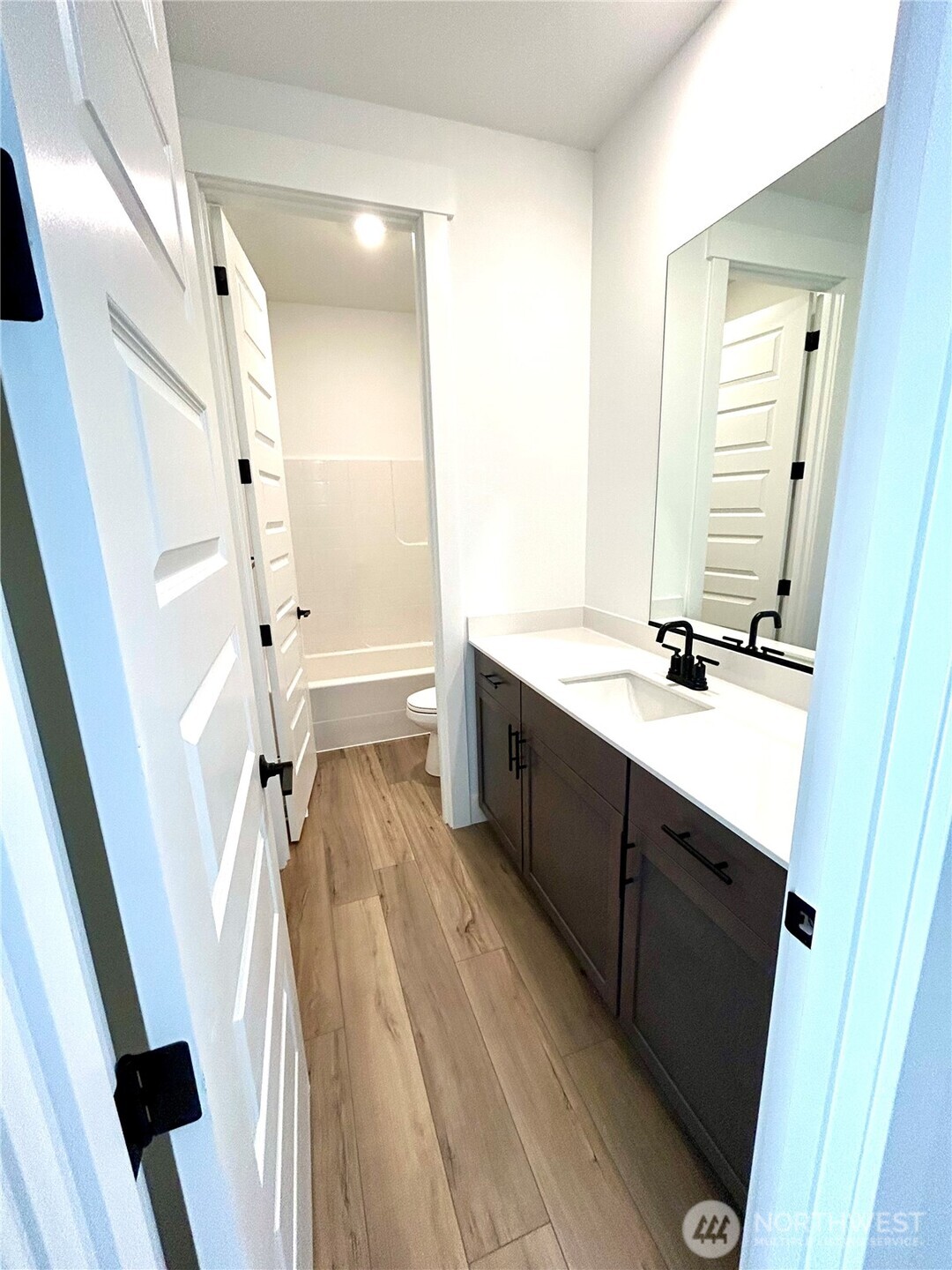 6034 Trce Drive Southwest Port Orchard, WA 98367 - Photo 18 of 40 a bathroom with a sink a toilet a tub and shower