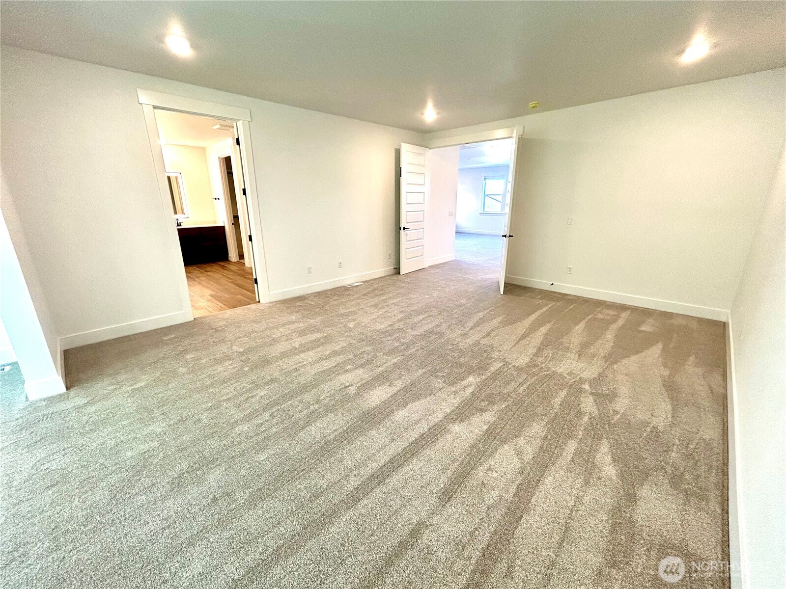 6034 Trce Drive Southwest Port Orchard, WA 98367 - Photo 19 of 40 a view of an empty room with wooden floor