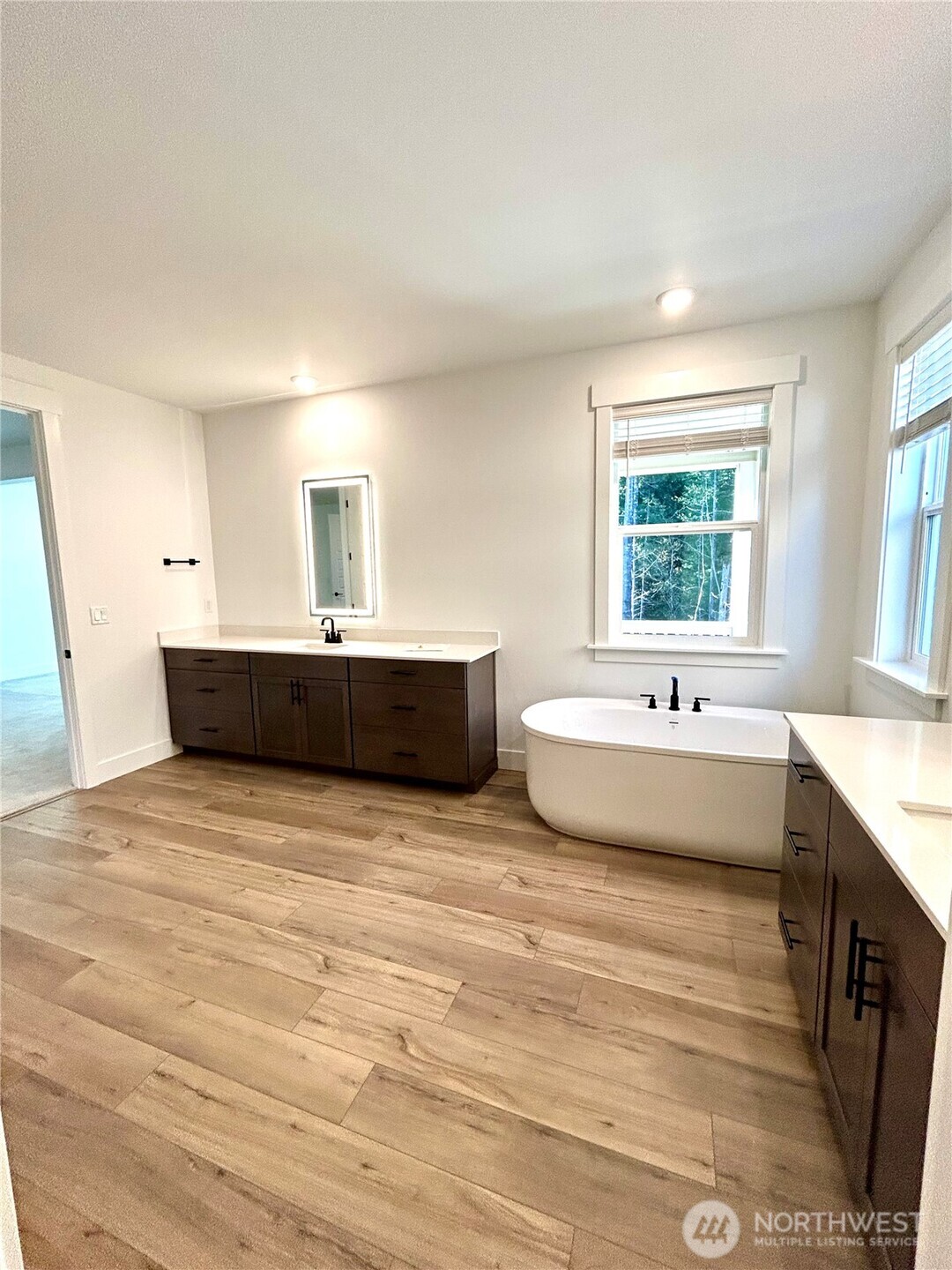 6034 Trce Drive Southwest Port Orchard, WA 98367 - Photo 21 of 40 a bathroom with a tub sink and mirror
