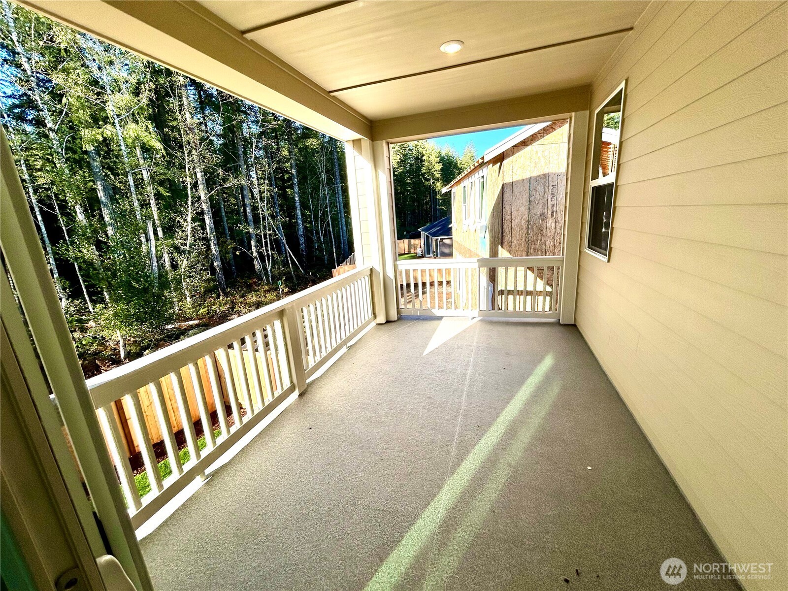 6034 Trce Drive Southwest Port Orchard, WA 98367 - Photo 29 of 40 a view of a balcony with wooden floor