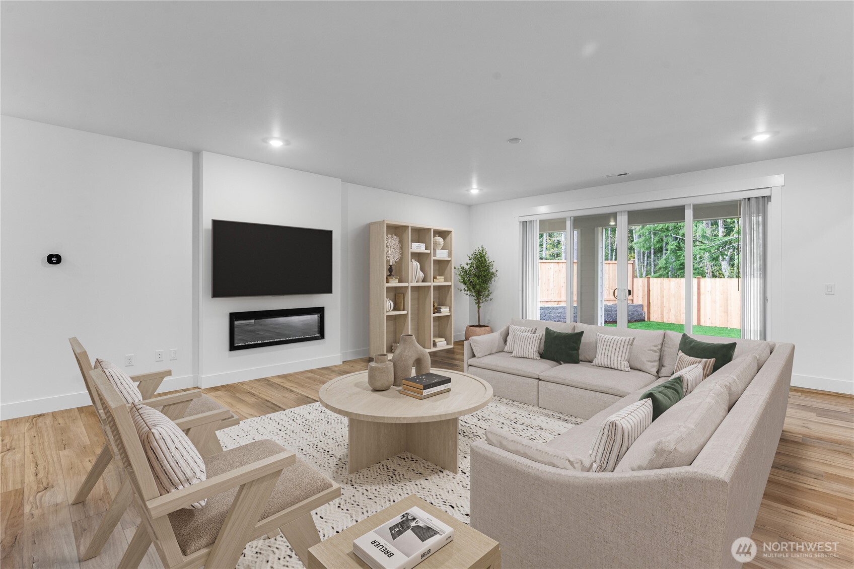 6034 Trce Drive Southwest Port Orchard, WA 98367 - Photo 5 of 40 a living room with fireplace furniture and a flat screen tv
