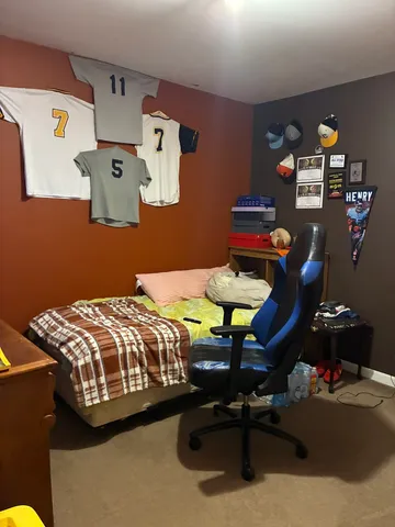 a bedroom with a bed and cabinets