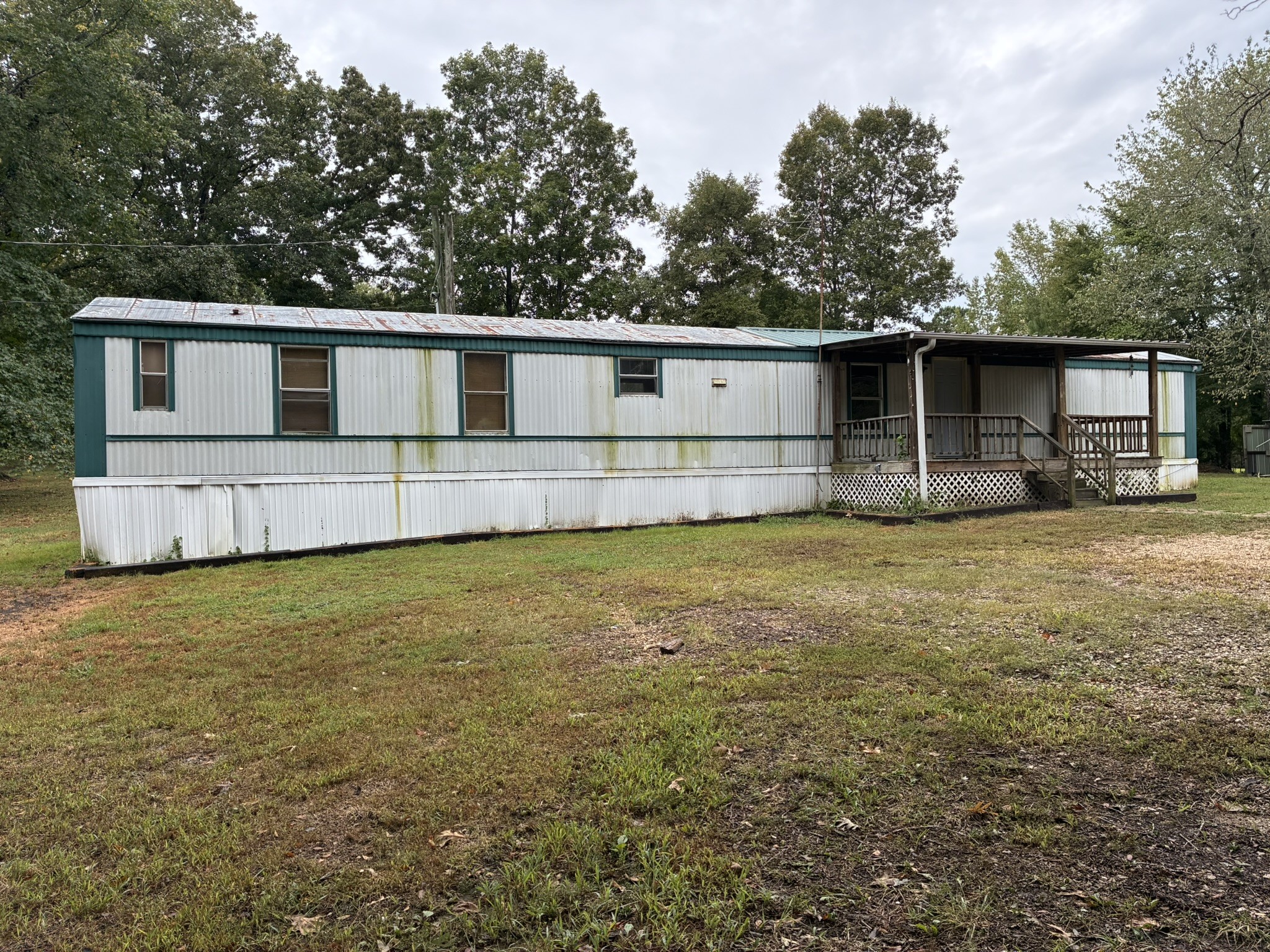 2765 Birdsong Road Camden, TN 38320 - Photo 15 of 18 a front view of house with yard and trees in the background